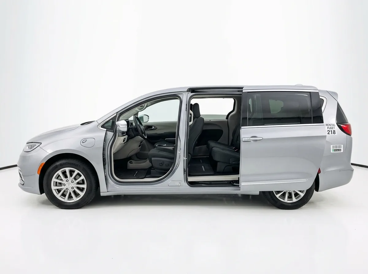 Chrysler Pacifica minivan, silver, side view with sliding door open, rental fleet, clean white studio background